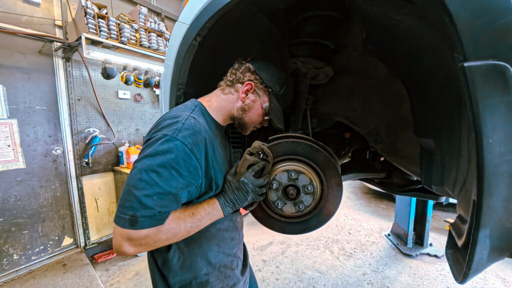 auto mechanic shop man near car